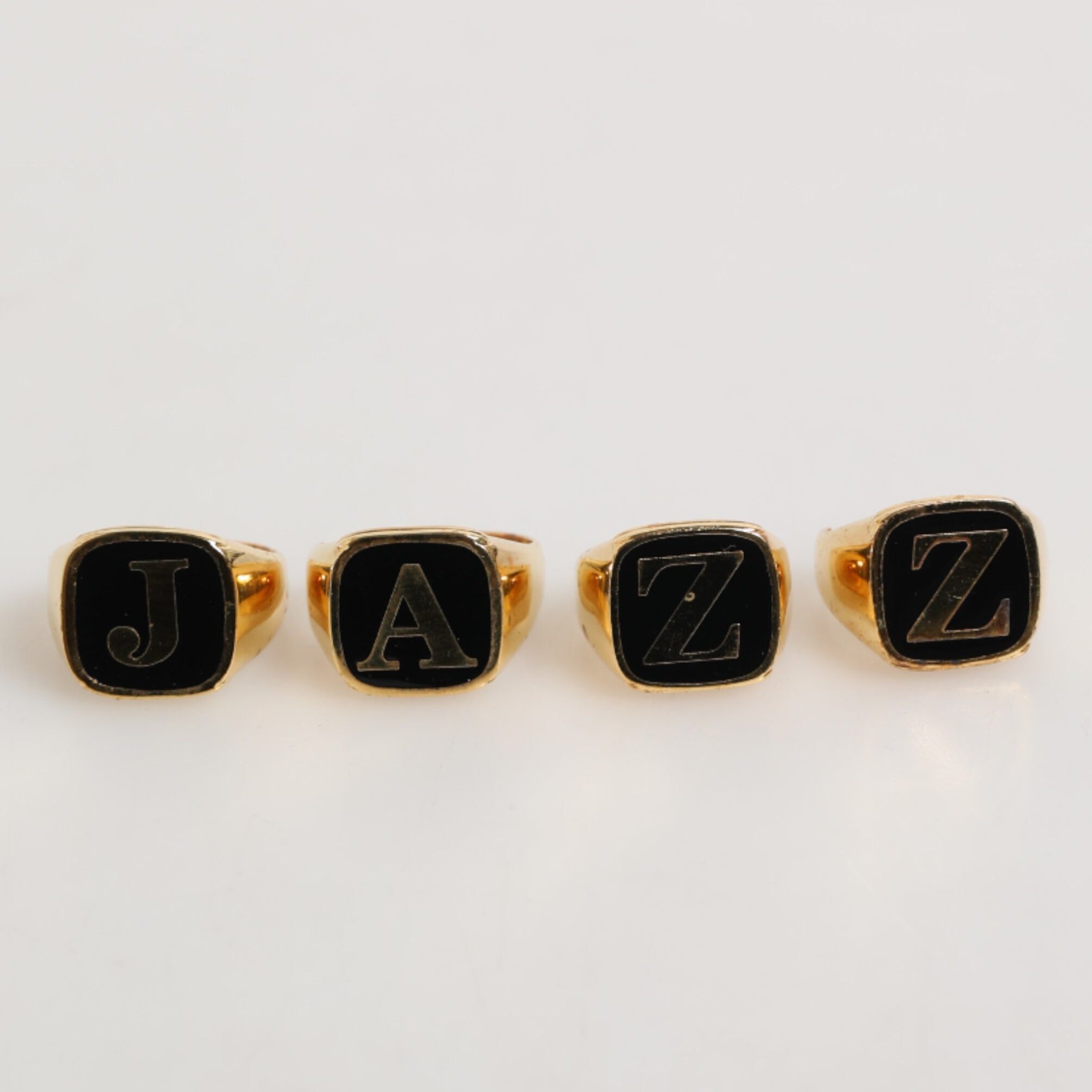 Dolce & Gabbana Gold Tone Brass JAZZ Letter Set 4 Pieces Adjustable Ring Dolce & Gabbana